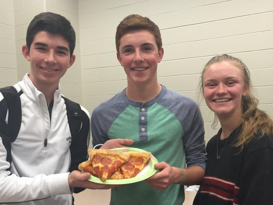 Sophomores Gunnar Hanson, Robbie Gonyea, and Brynne Newland celebrate with pizza after recieving Panther Plus Awards