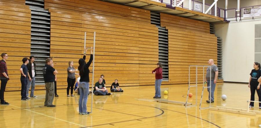 Robotics students direct mentors as though they were competition robots. 