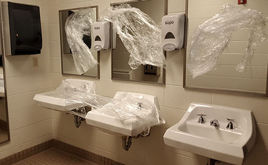 Bathrooms are vandalized with Saran Wrap