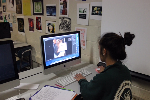 Senior Vivian Ly edits photos during photography.  Ly does a lot of photography and editing on her own time as well.