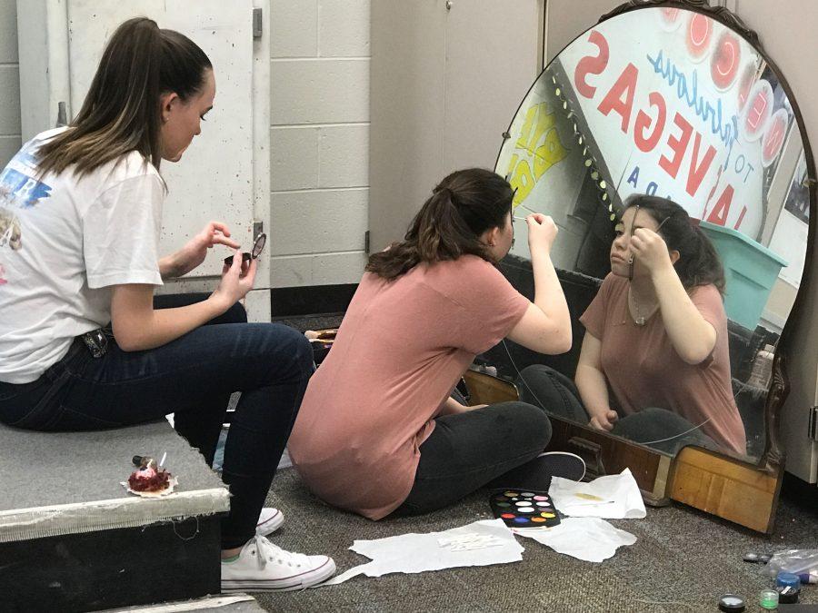 Theatre students practice stage makeup