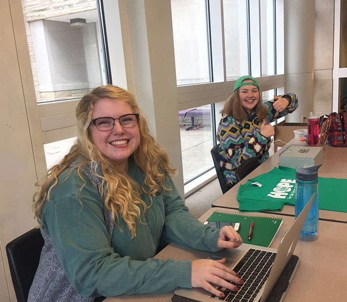 Dance Marathon Junior execs Brittany Underwood and Zoe Berensztein sell tickets for Saturday 