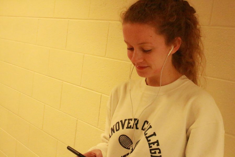 Senior Hadley Knaus listens to music in the South hallways