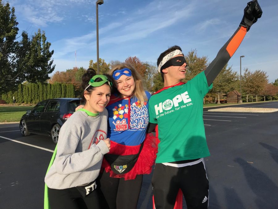 Current DM president Zoe Berenzstein (middle) poses with Junior President Tommy Mcevilly (Left) and Junior Fundraising VP Taylor Harmon (right)