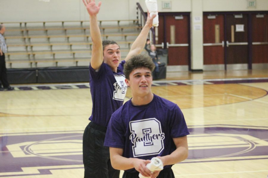 Sophomore Jedd Conrad (Front) and Senior Sam Conrad joined the cheerleading squad after deciding not to play football this year. The two brothers cheer at the varsity boys basketball games.