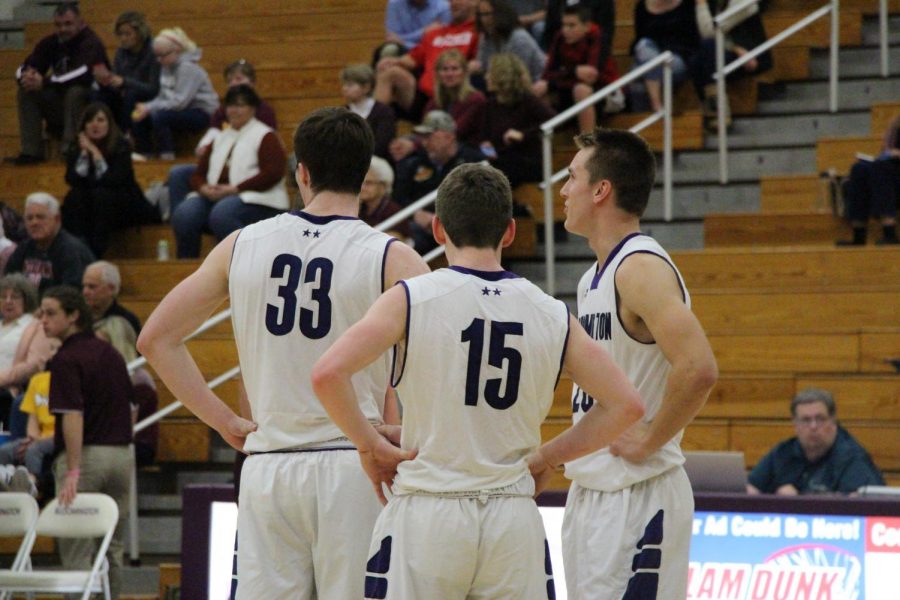 Senior Chance Coyle (left) sophomore Noah Jager (middle) and senior Chris Bomba (right) stand waiting after a foul is called. The Panthers played against crosstown rival North in a preseason scrimmage this past Thursday, November 16th, and won 62-39