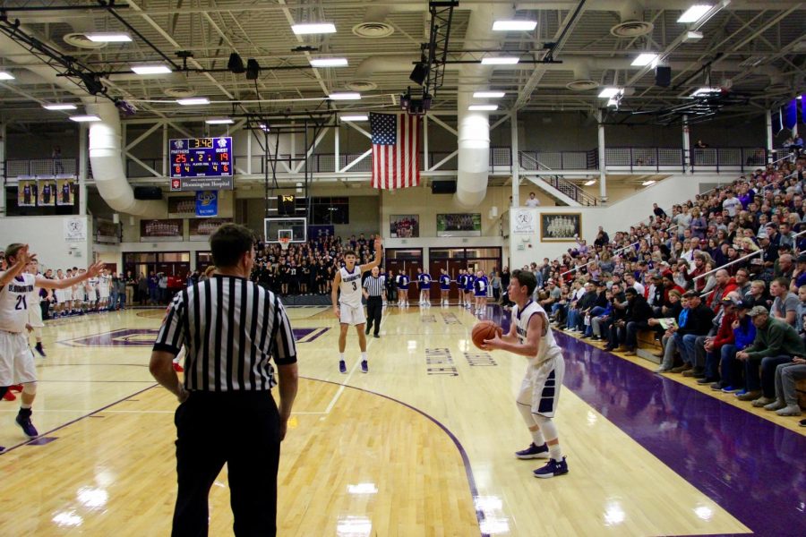 Junior, then sophomore Noah Jager shoots a three pointer during a game against New Albany on Nov. 25, 2017.