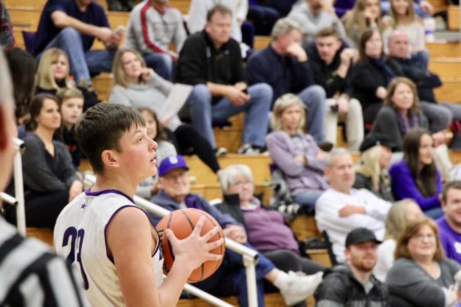 James Bomba (23) holds the ball for the final seconds of the game.