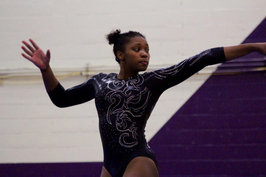 North's Brittany Laffon poses during her floor routine. Laffon was first in all-around, beam and floor. 