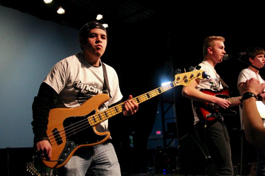 South senior and Elm Heights Band member Daniel Deckard rocks out while playing his bass guitar. 