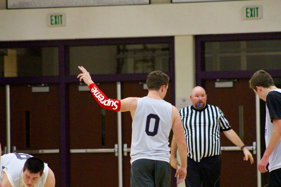 Team Supreme player Jack Hanchett points to the fan section.