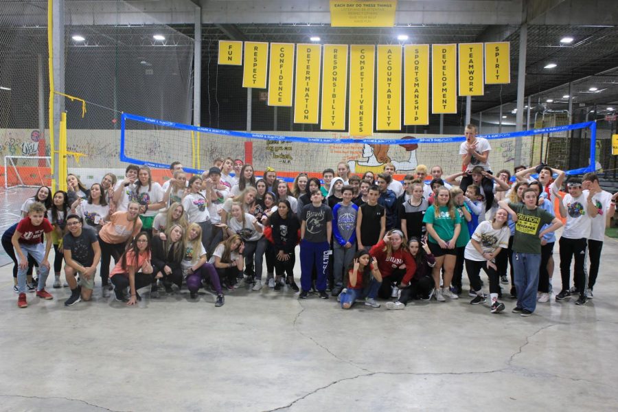 Middle school students pose with South and North executives after the middle school Red Hot hours end.