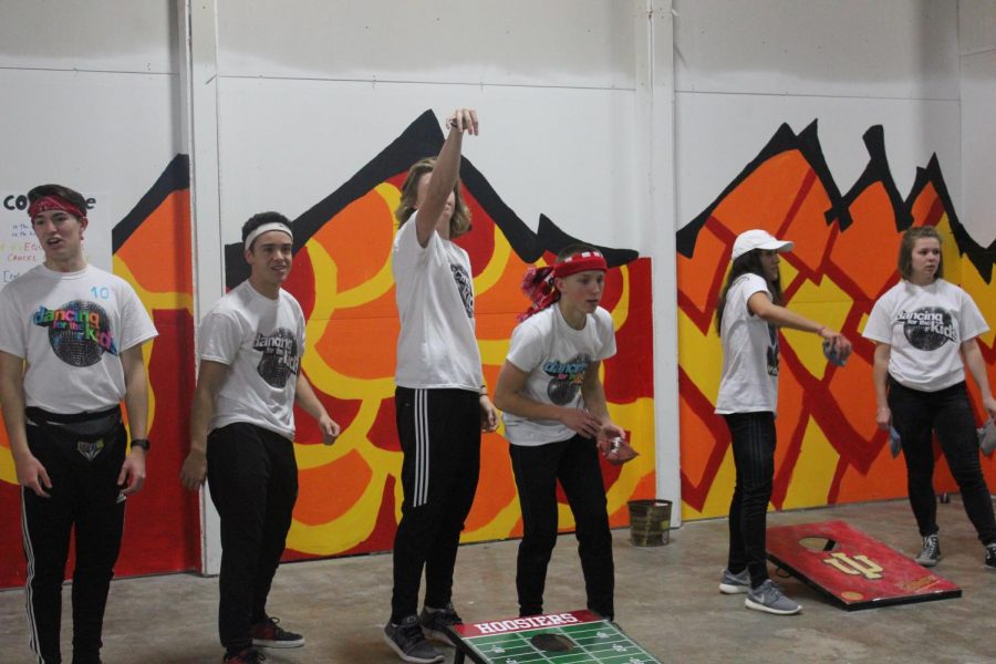 Cornhole players warm up before the tournament starts 