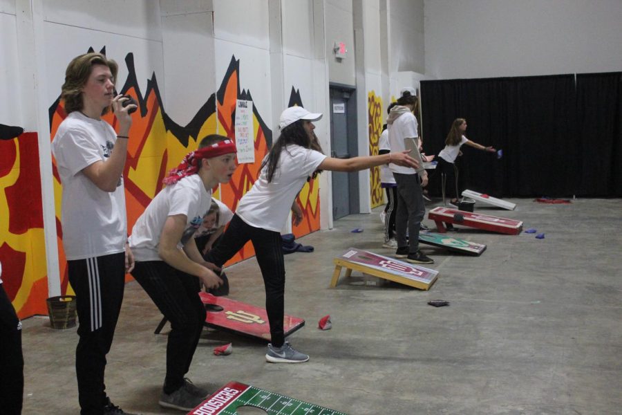 Cornhole players warm up before the tournament starts 