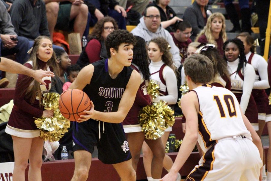 South's Anthony Leal (3) is guarded by North's Issac Vencel (10).