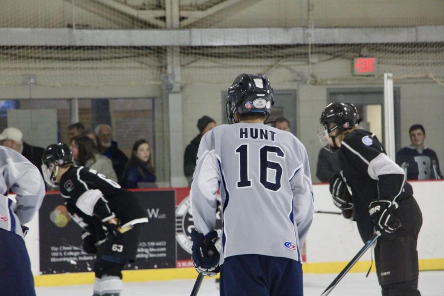 Bloomington's Ryan Hunt (16) watches a face off.