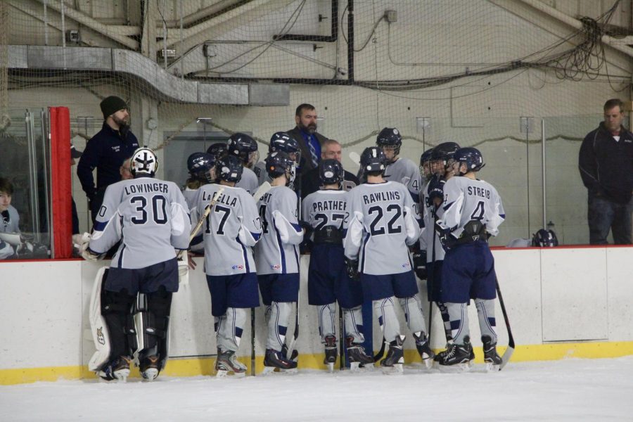 Bloomington Blades players huddle on the bench during a timeout.