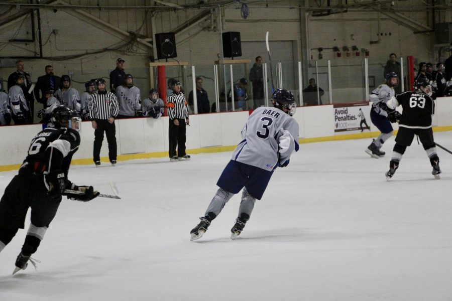 Bloomingtons Ethan Baer (3) skates towards the goal. 