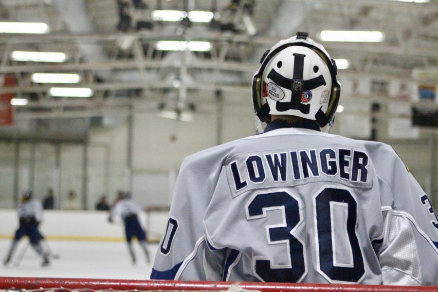 Bloomington's Aidan Lowinger (30) watches from the goal.
