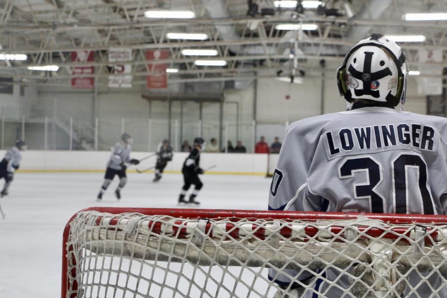 Bloomingtons Aidan Lowinger (30) watches from the goal.