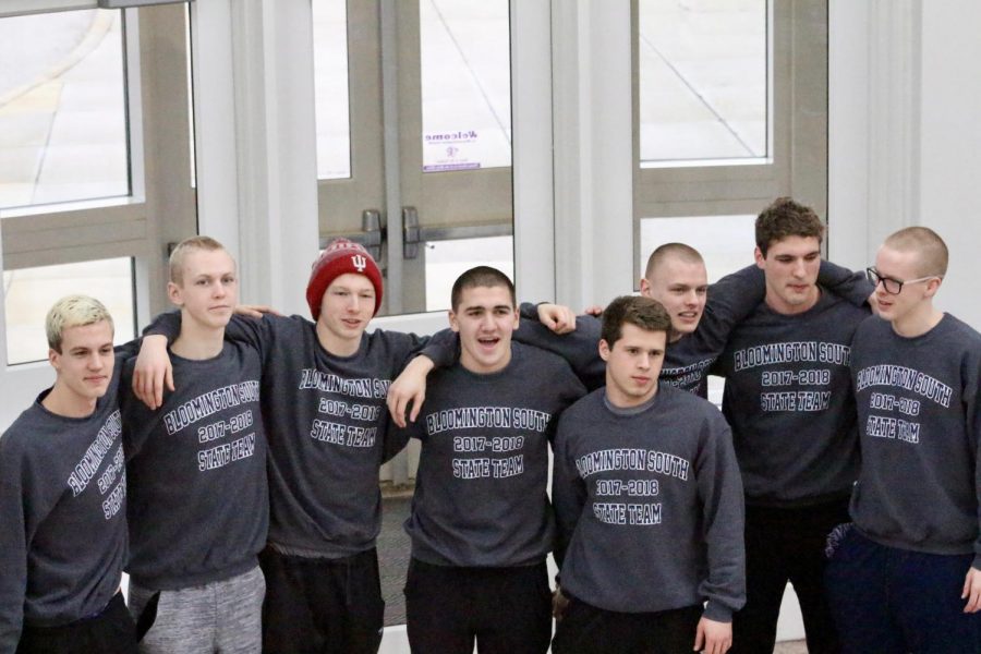 L-R: Seth Glasscock, Tommy Beggs, Max Grogg, Creighton King, Wesley Webb, Luke Lobring, Paul Gabhart, and Wyeth Michealsen pose together before leaving to compete in the boys swim and dive state championships