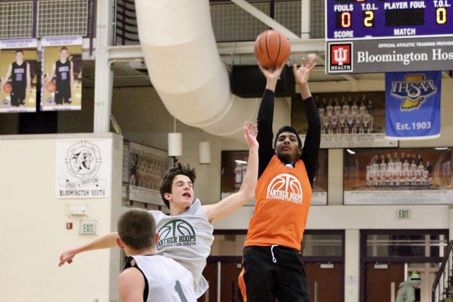 Ball Brothers guard JJ Thomas shoots over Ca$h Money forward Alan Morris