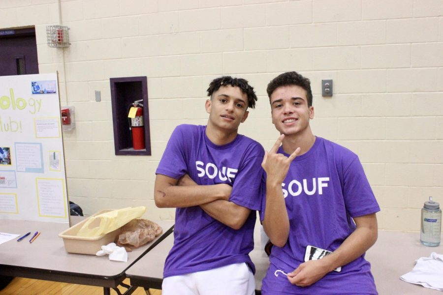 Seniors Isaiah Perine and Giovanni Alicea pose in front of the South Side 6th man booth. 