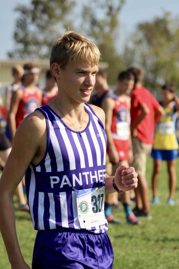 Senior Wilson Zinkan warms up before the start of the 2018 IHSAA cross country sectional championships at Bedford North Lawrence.