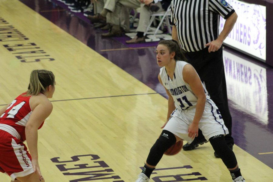 Senior Addy Blackwell (21) dribbles the ball as she prepares to make a play