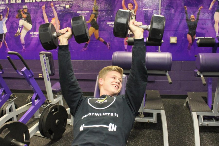 Senior Austin Willis runs a bodybuilding account on Instagram. Willis is pictured above lifting in the South weight room.