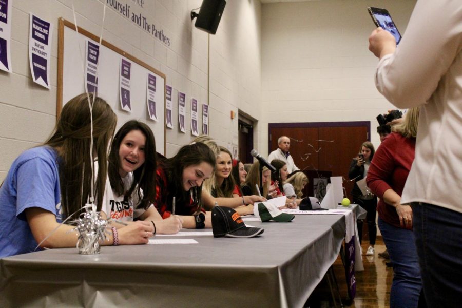 South Volleyball seniors Katelyn Bucy and Bria Ooley converse after signing their letters of intent.