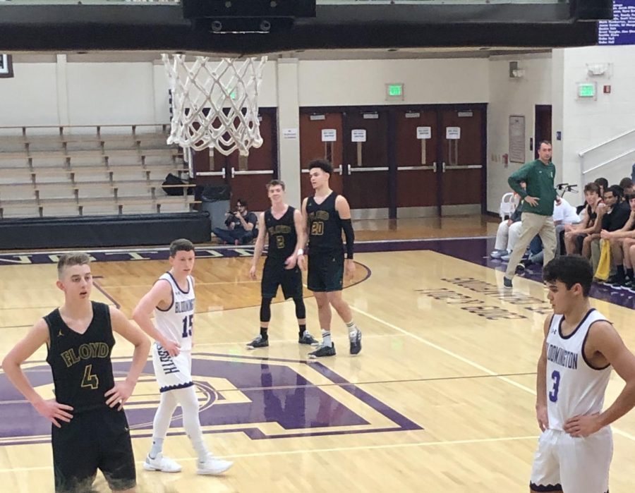 South's Noah Jager (15) and Anthony Leal (3) look on as Floyd Central's Jake Heidbreder (4) prepares to shoot a free throw