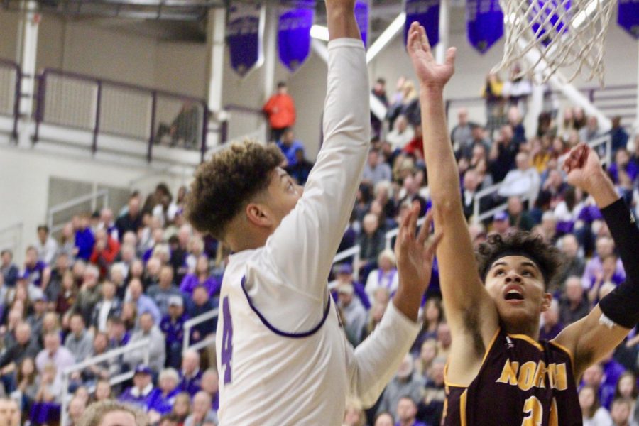 South's Jordan Meeks goes for a layup against North's Chris Thomas (31)