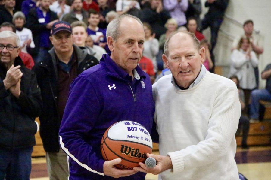 Past wins leader Jack Butcher presents Holmes with his memorial ball