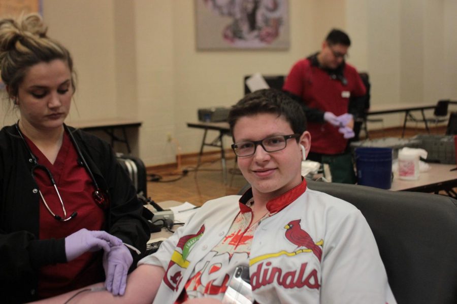 Bryce giving blood at the Red Cross blood drive this Thursday.