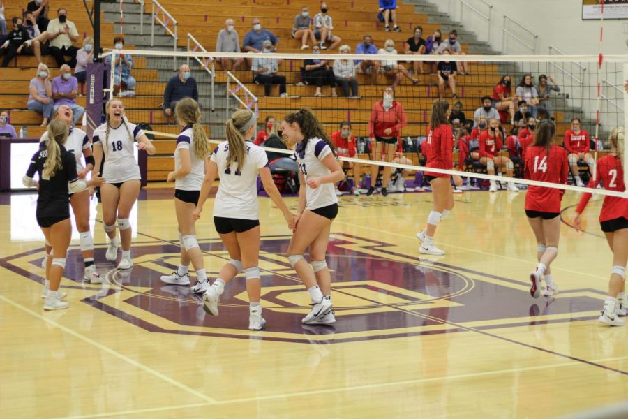 Bailey DeMier (17) and Kenadee Coyle (33) celebrate a point during their game against Southport on September 3, 2020.