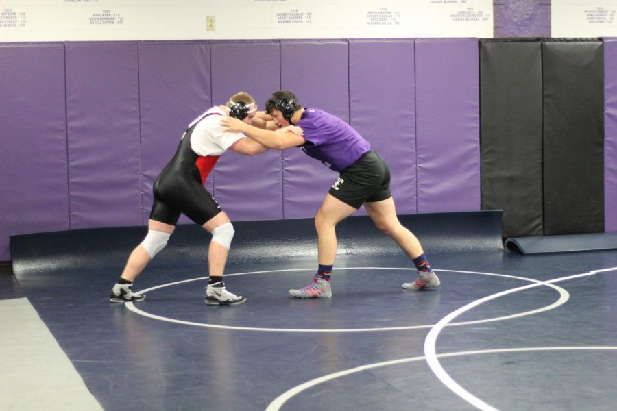 Tristan Ruhlman (right) wrestles at practice on December 3.