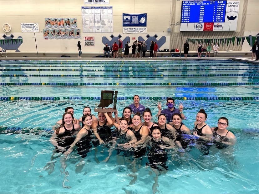 The swim team celebrates in the Columbus North pool after winning Sectionals on February 6, 2021. Photo credit: Allie Arnold.