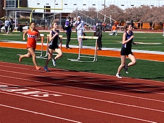 South freshmen Nora LoPilato and Clara Graham compete for the Panthers at the track meet April 3 against Columbus East. The girls team won 76-56, while the boys also triumphed 75-56.
