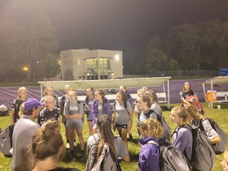 Head Coach David Prall talks to his soccer team prior to a game. 