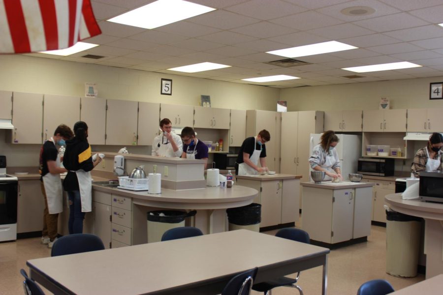 Students knead dough in Jeana Kerr's nutrition class.