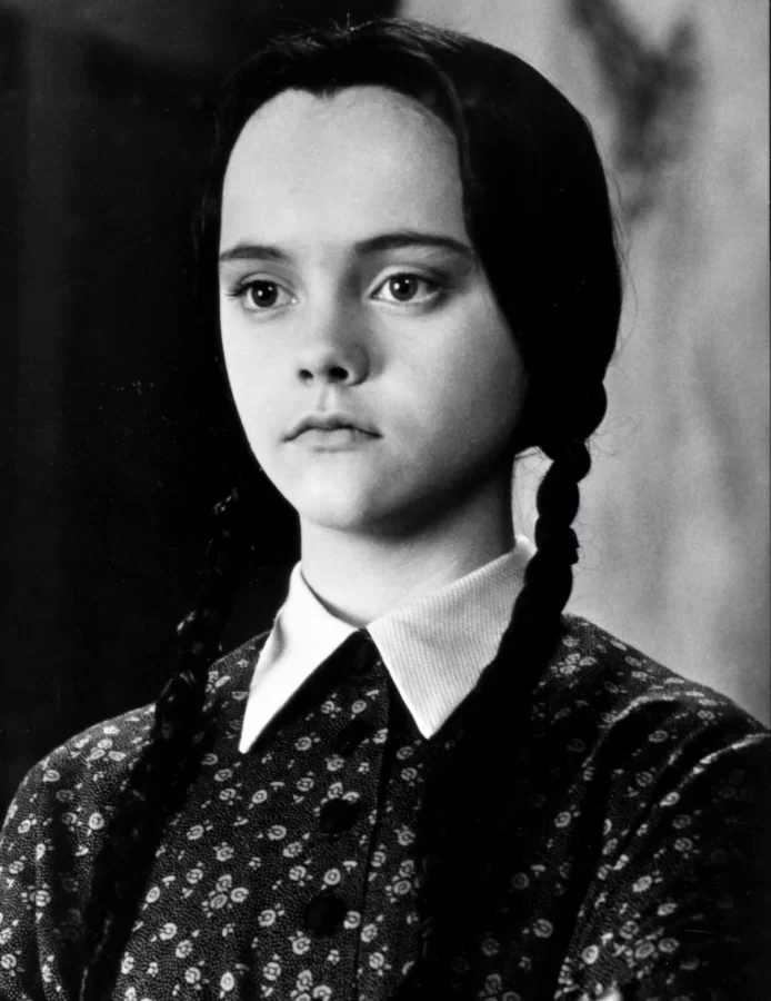 a black and white photo of christina ricci as wednesday addams