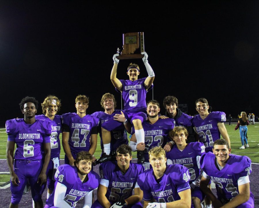 Football seniors pose with Sectional Championship trophy