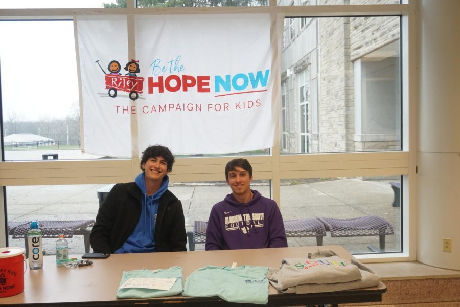 Rhett Johnson and Griffin Gillard, seniors, sell merchandise for Dance Marathon