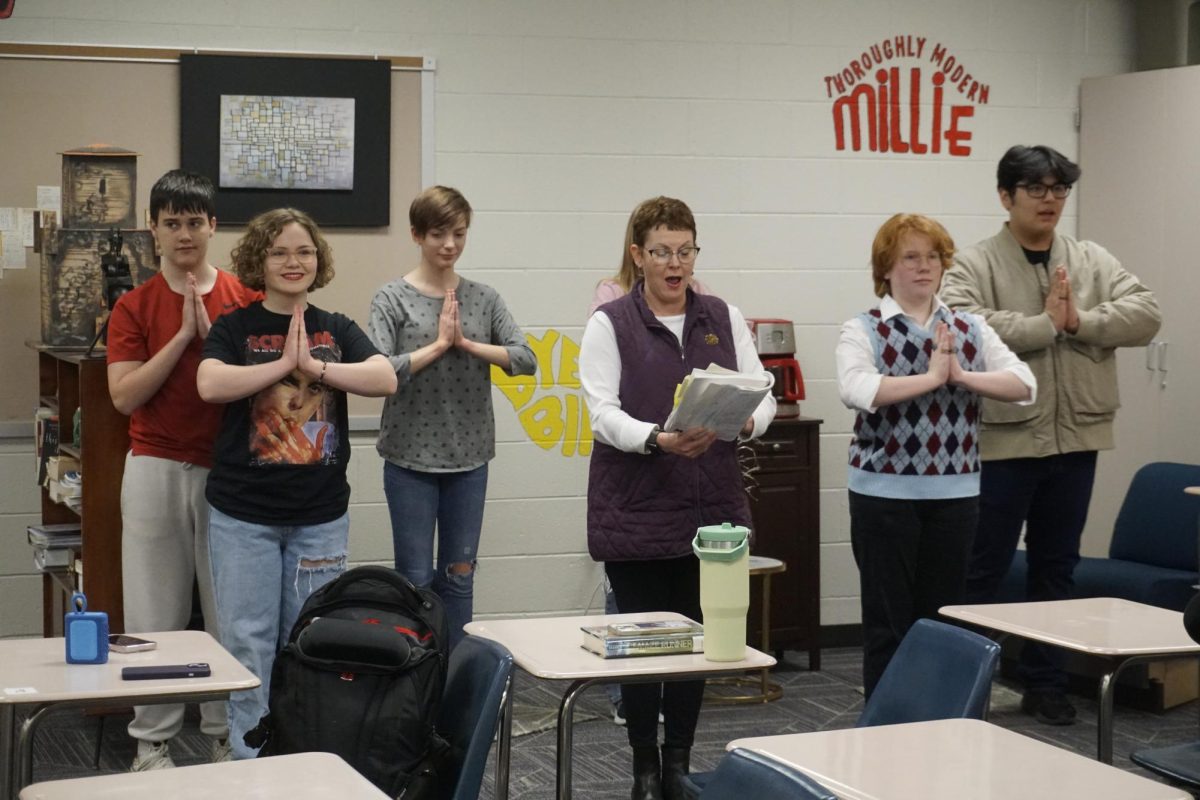 Ms. Rademacher practicing with the cast of Annie