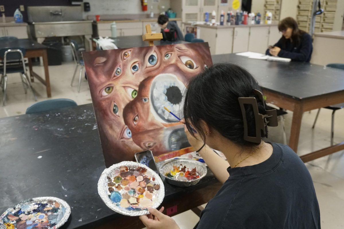 Vivian Niu working on her art for Advanced Painting