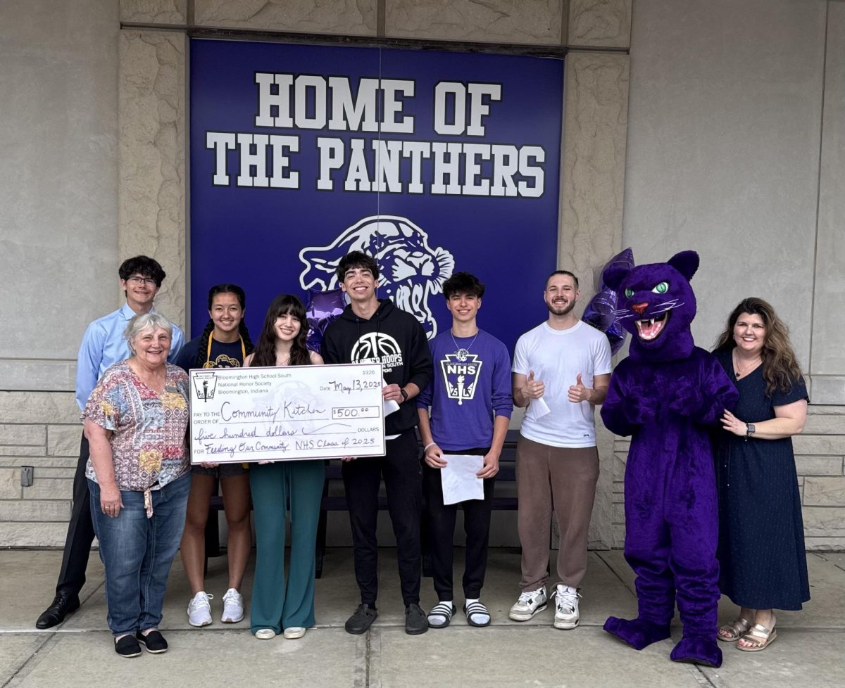 NHS presents June Taylor from the Community Kitchen with a $500 donation at the Honor Cord party
