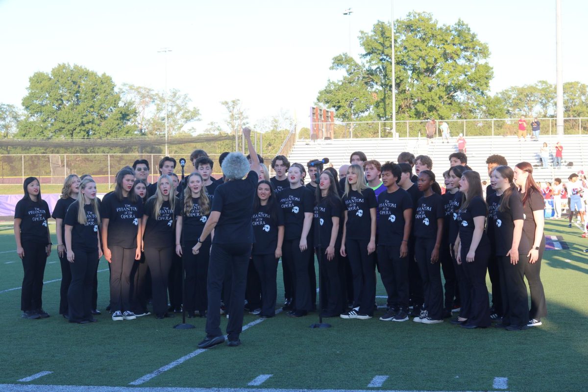 Sounds of South performs the national anthem at South's homecoming game
