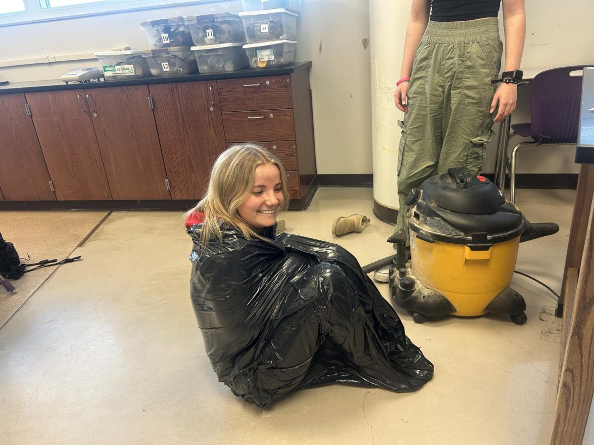 Chemistry students learn about gas laws in a hands-on experiment