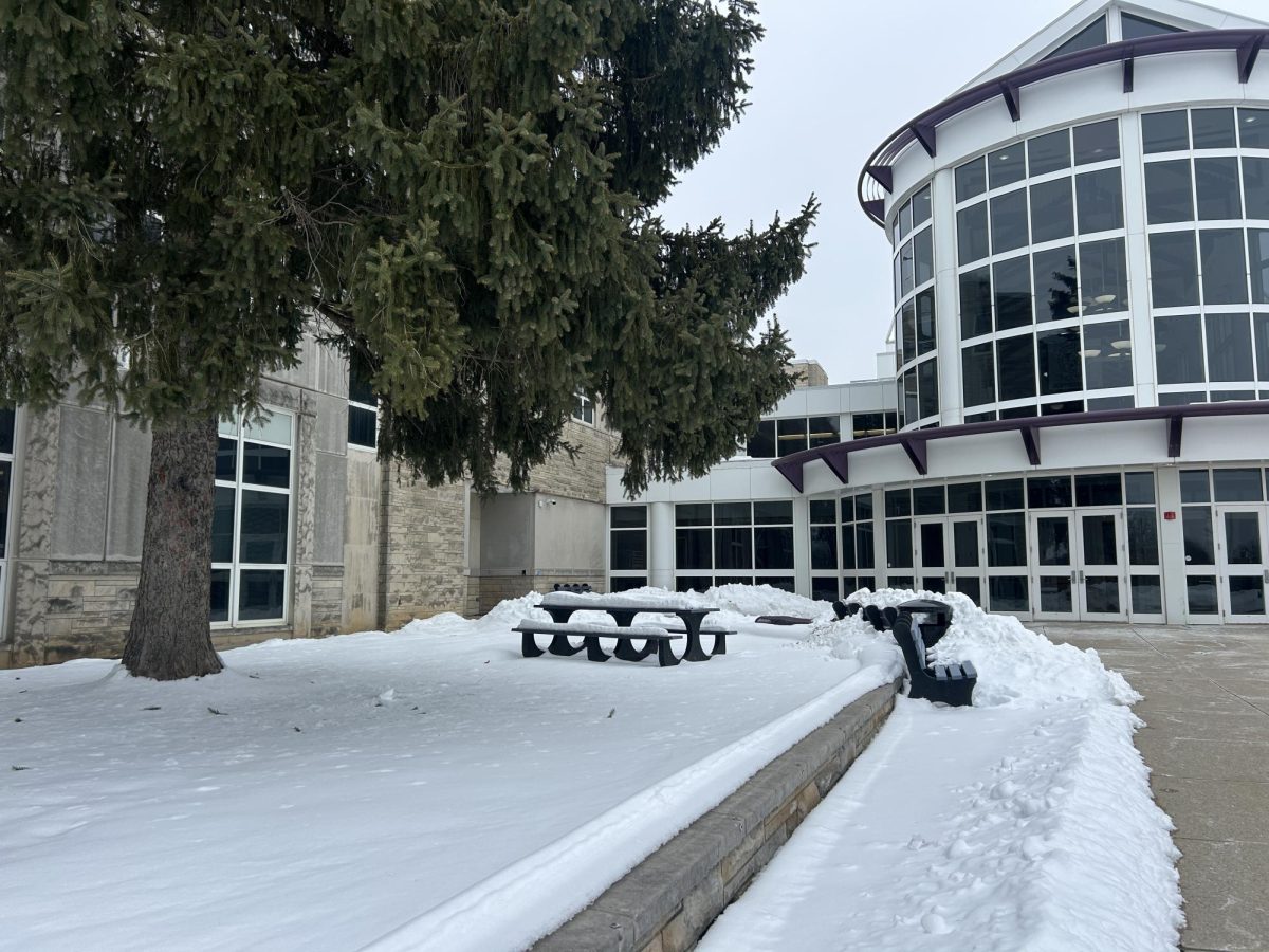 Snow covers the front grounds of Bloomington South